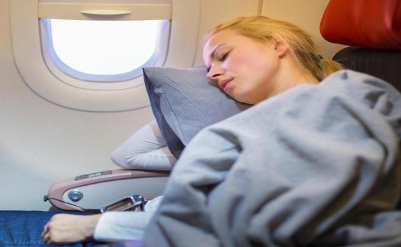 تحذير من مخاطر النوم بالطائرة Image